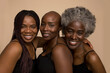 © Cultura Creative - Studio portrait of three smiling women in black tops