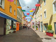 Lederergasse colorful street with floating umbrellas in Villach town, Austria