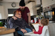 © Cultura Creative - Parents with baby son in high chair