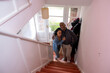 © Cultura Creative - Portrait of smiling couple standing in new house