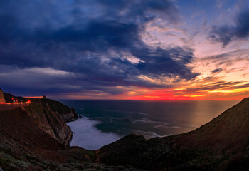 Wall Mural - Coastal cliffs and silky ocean by Devil's Slide trail in California at sunset