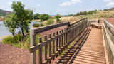 Fototapeta Pomosty - wooden pathway pedestrian bridge entrance lake lac du Salagou in France