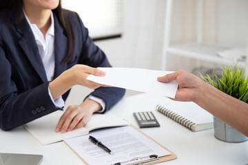 close up view of young asian business woman receiving salary or bonus money from boss or manager at 