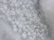 precipitation in the form of round snow as a background