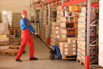 Poster - Worker with pallet jack at warehouse. Logistics center