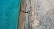 Aerial image of person walking along the beach