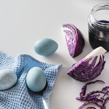 Dyed Blue Easter Eggs Painted With Natural Dye Red Cabbage On White Background.