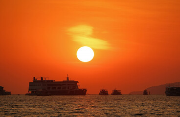 Wall Mural - beautiful red sunset at sea with ships