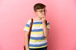 © luismolinero - Little redhead caucasian boy isolated on pink background having doubts while looking up