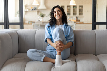 positive emotions. portrait of pretty caucasian woman smiling, laughing and looking at camera, sitti