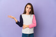 © luismolinero - Little girl isolated on purple background having doubts
