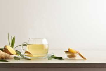 Poster - Ginger beverage on table with ginger root white isolated background