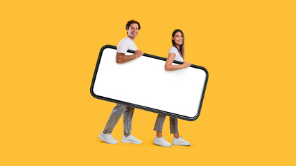 Wall Mural - Couple walking with big white empty smartphone screen