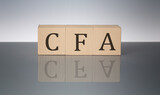 Fototapeta Mapy - CFA concept, wooden word block on the grey background