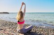 © Valerii Honcharuk - Active middle aged woman in sportswear doing workout on the beach.