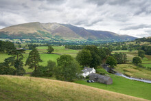 Distant View Of Blencathra, Gategill Fell Top, Blease Fell And Middle Tongue That Stands Above The Small Village Of Threlkeld In The English Lake District, England, UK.
