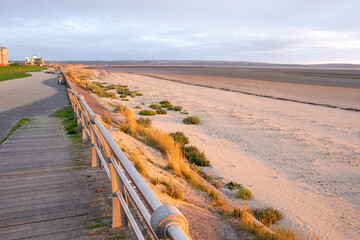 Wall Mural - Sunset along Llanelli beach in Wales.