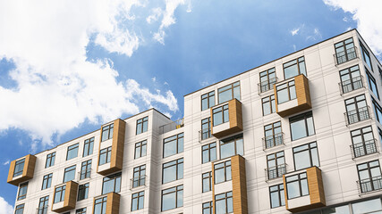 Wall Mural - Modern residential building on a sunny day with a blue sky. 3d illustration