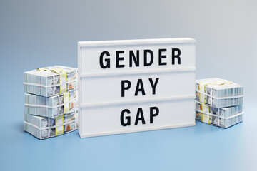 Gender pay gap concept: Two heaps of 100 dollar notes with different height and a lightbox with the words 