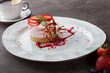 Fresh strawberry cheese cake served with berries and caramel decoration