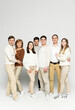 © Vadym - a big happy family of seven stands on a white background. family concept. father with mother and adult children. beautiful group of people of different ages
