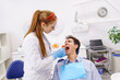 © Igor Kardasov - Man opening mouth during teeth examination