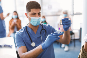 Wall Mural - Doctor Taking Dose Of Covid-19 Vaccine, Selective Focus