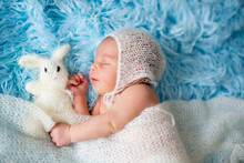 Little Cute Newborn Baby Boy, Sleeping Wrapped In White Wrap