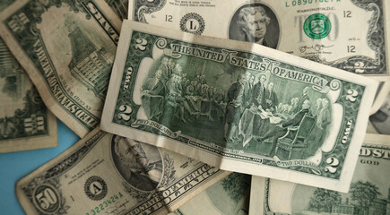 Background from money. Two dollar bills. Scattered dollars.