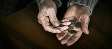 Pensioner Counting Money Into Her Hands