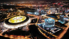 Aerial Drone Night Shot Of Iconic Illuminated London Stadium Facilities In Queen Elizabeth Park, London, United Kingdom