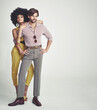© Yuri Arcurs/peopleimages.com - The perfect retro couple. An attractive young couple standing together in retro 70s clothing.