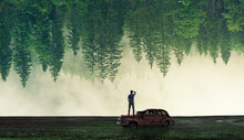 Strange Trees View Of A Person On The Old Truck In The Grass High Quality Wallpaper Design.