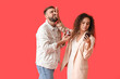 © Pixel-Shot - Young African-American woman rejecting marriage proposal on color background