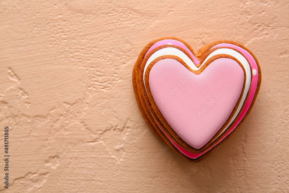 Stack of tasty heart shaped cookies on beige background