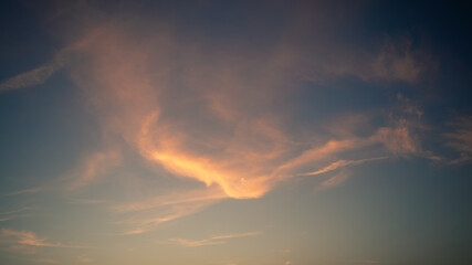 Wall Mural - Wonderful view of cumulus clouds sky with orange sun light at sunset of summer