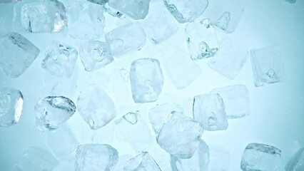 Fototapete - Super slow motion of falling ice cubes separated on blue background. Filmed on high speed cinema camera, 1000 fps. Speed ramp effect.