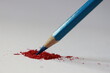 blue pencil color on red scratches and white background 