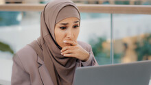 Sad Muslim Girl Student In Hijab Looking At Laptop Screen Reading Email Shocked By Bad News Frustrated Businesswoman Worries About Financial Problems Gets Failed Exam Results College Dropout Lost Job