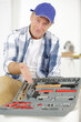 © auremar - portrait of plumber man showing his tool box