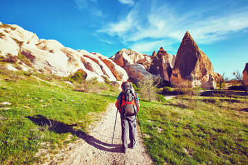 Wall Mural - Traveling is a tourist route with a backpack.