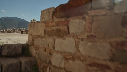 Wall Mural - Moving up the stairs of an ancient greek chapel to reveal the beautiful scenery of the mountainside