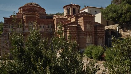 Wall Mural - Pushing in into an ancient greek chapel in golden sunlight and blue sky