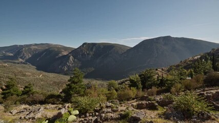 Wall Mural - Delphi - revealing the beautiful view into the greek landscape at sunset