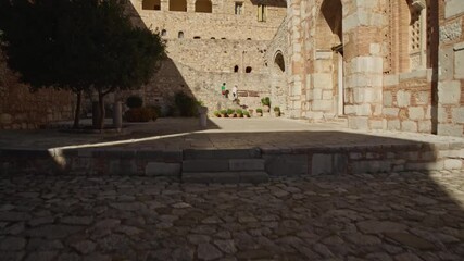 Wall Mural - Revealing the inside of an ancient greek chapel with golden sunlight and a deep blue sky