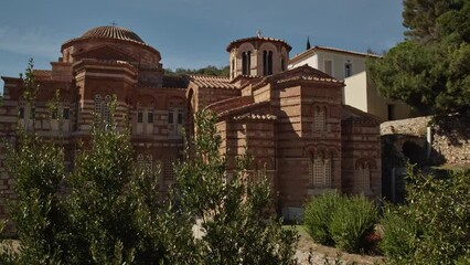 Wall Mural - An ancient greek chapel in golden sunlight and blue sky