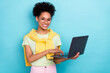 © deagreez - Photo of youth african girl use laptop workshop manager wear eyeglasses isolated over blue color background