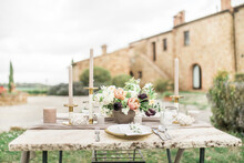 Wedding Reception Table With Flowers And Rustic Gold And White Decoration,  Outdoors