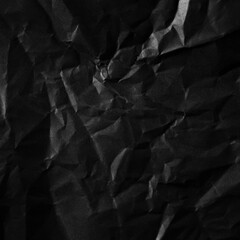Poster - Textured crumpled black paper background.