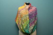 Knitted Handmade Shawl On A White Mannequin - Multicolored Yarn.